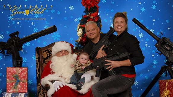 Toddlers And Shotguns Say Merry Christmas In Awkward Family Photos