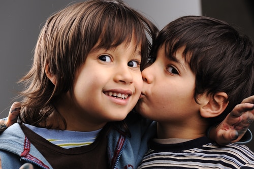 kids kissing on the lips with other kids