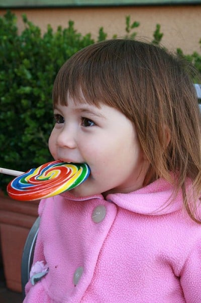 bibing with lollipop