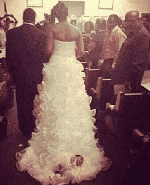 Epic Bride Attached Her Newborn To Her Wedding Dress Train And People Are Freaking