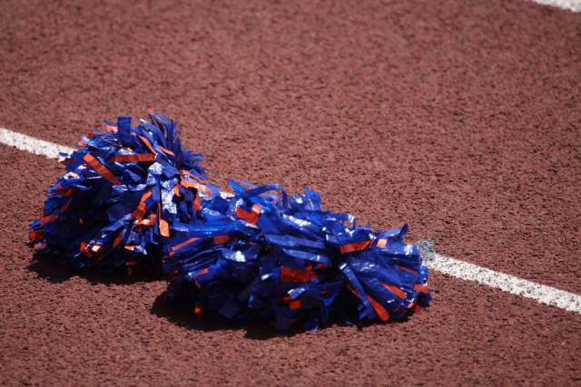 Cheerleader Kicked Off Squad For Kissing Football Player