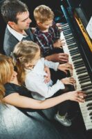 Family playing piano.