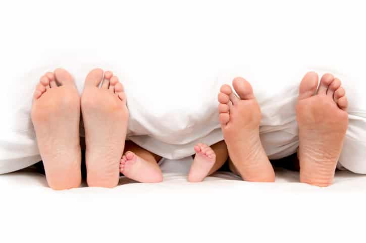 People Doing Weird Things With Babies’ Feet in Stock Photos