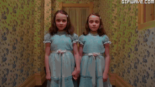 Hilarious Dad Teaches Twin Daughters to Scare People in Hotel Hallways