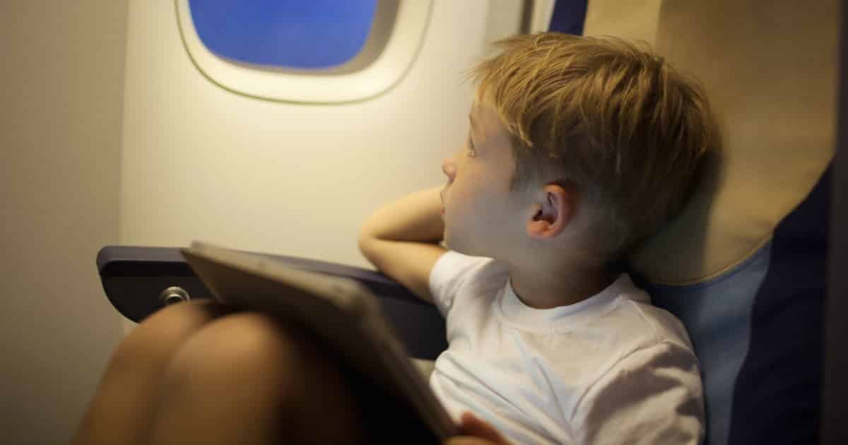 Little boy traveling by plane.