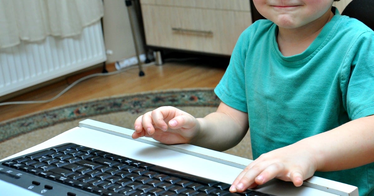 young boy using computer