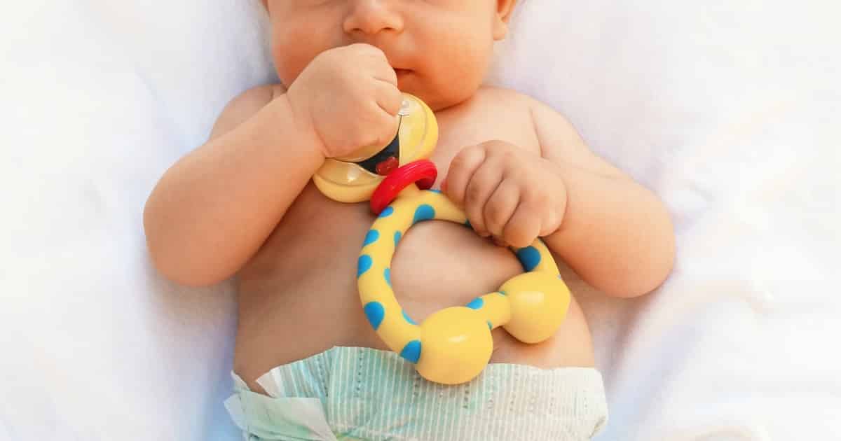baby with teething toy