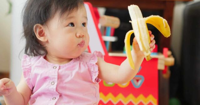 girl eating banana does your child need to be on the brat diet