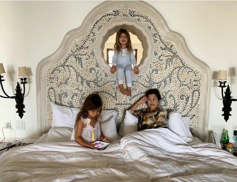 Kourtney Kardashian and her two daughters pose in bedroom
