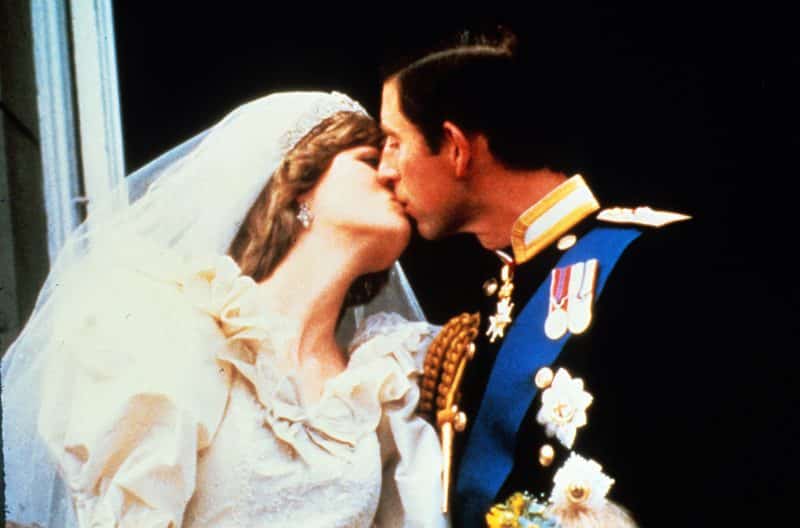 Prince Charles, Prince of Wales and Diana, Princess of Wales kiss on the balcony of Buckingham Palace following their wedding